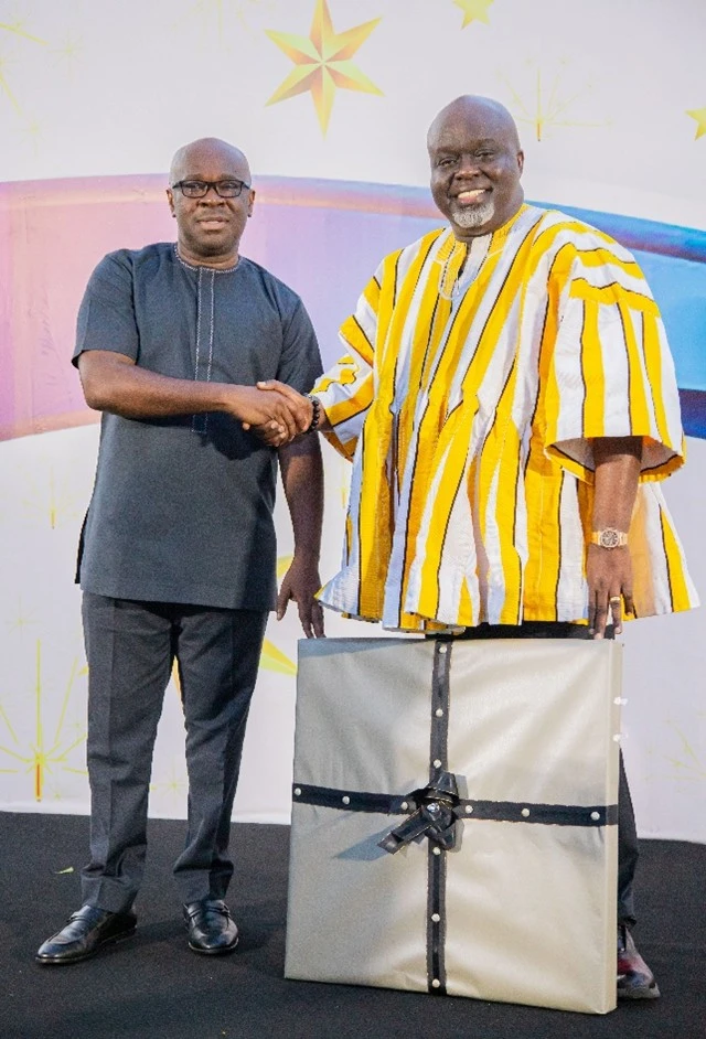 Mr. Kwamina Asomaning, President of GAB presenting a citation to the Mr. John Adomakoh, former president of GAB and the Former MD of GCB Bank